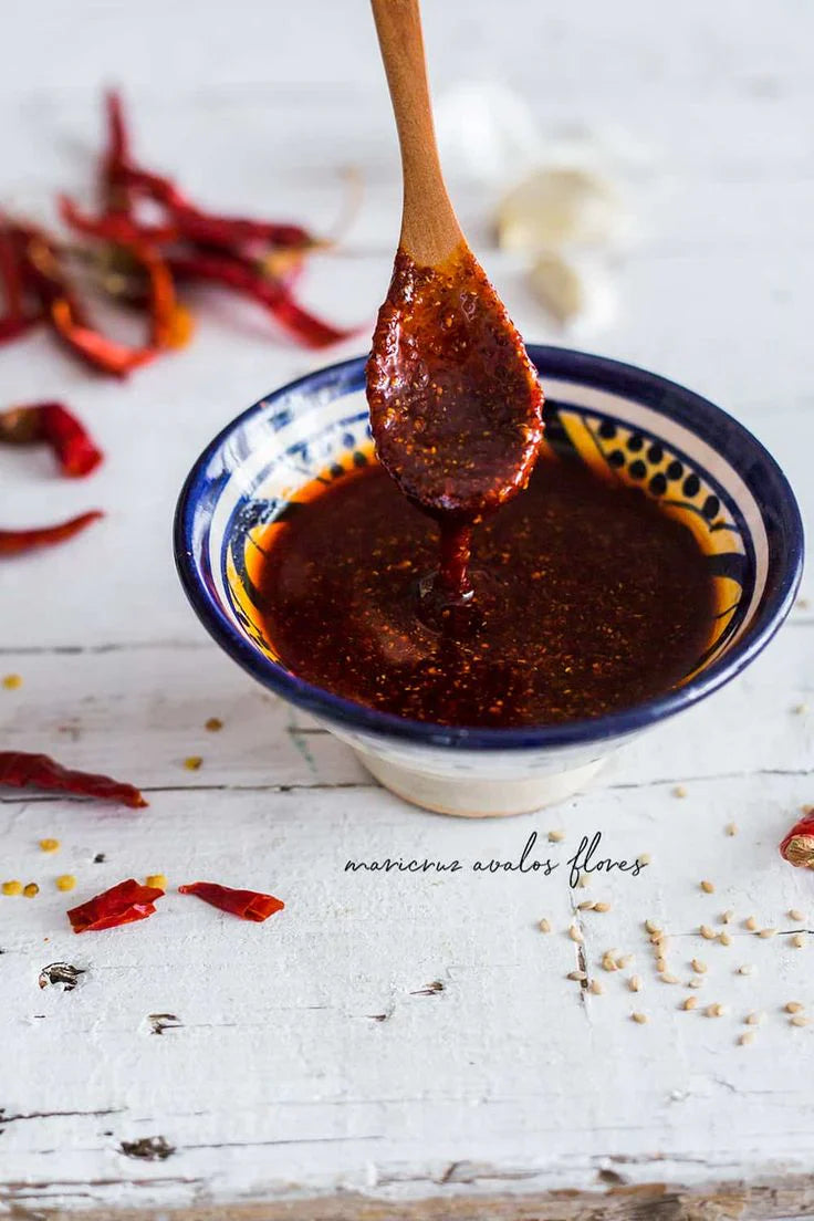 Rich and flavorful chili oil mixture made with Birria Queen’s Chili Powder, perfect for creating authentic Mexican birria dishes
