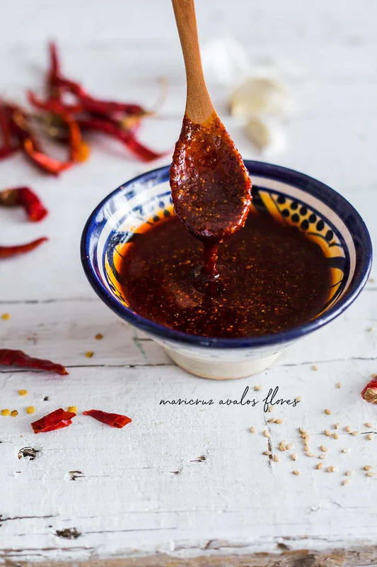 Rich and flavorful chili oil mixture made with Birria Queen’s Chili Powder, perfect for creating authentic Mexican birria dishes